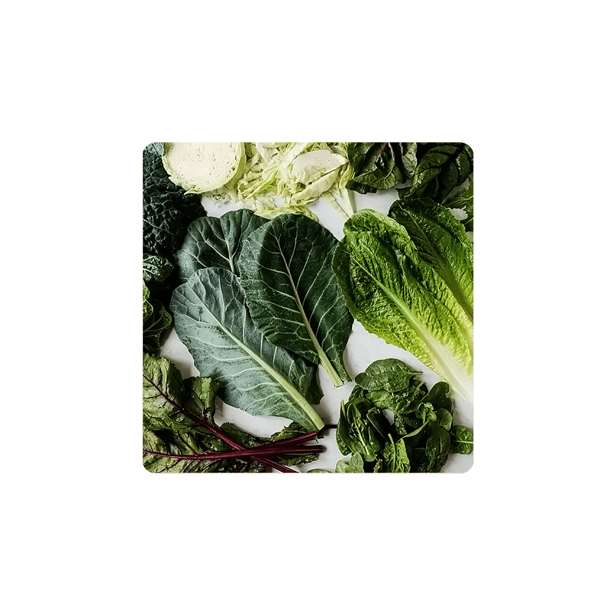 Fresh green leafy vegetables including collard greens and romaine lettuce rich in Magnesium.