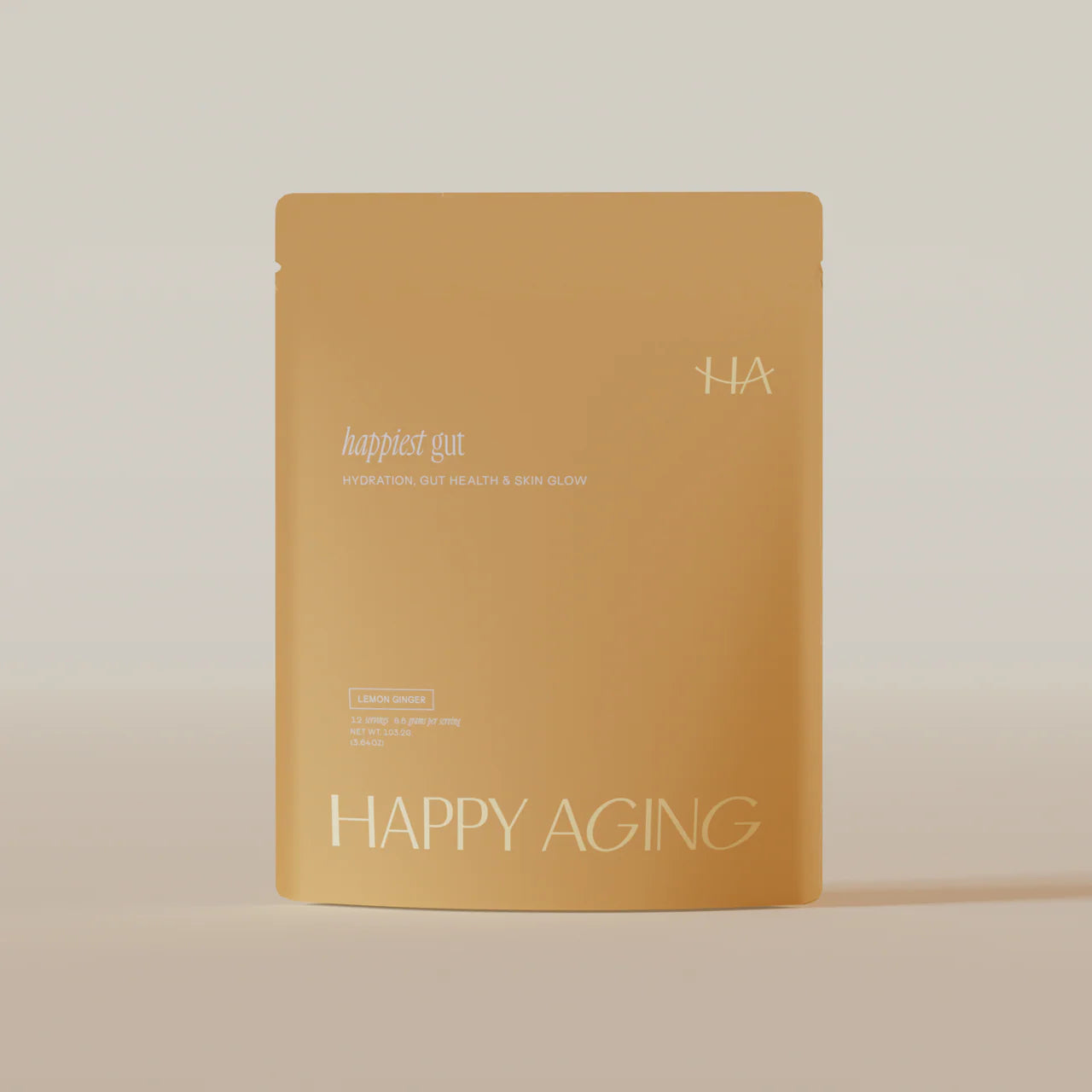 Yellow sheet mask with 'happiest gun' branding on a beige background
