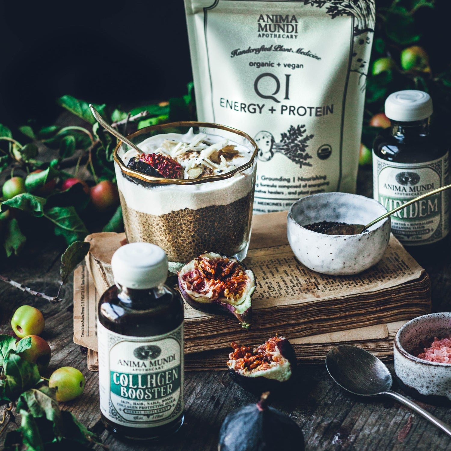 Spice blend with a glass of liquid on a wooden surface, surrounded by bottles and containers.