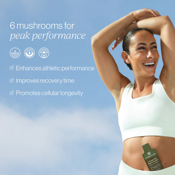 Longevity Mushrooms pouches displayed by a smiling woman promoting peak performance and cellular longevity.