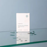 Cynobiota Molecular Hydrogen skincare product packaging on a reflective surface with a light blue background