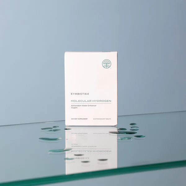 Cynobiota Molecular Hydrogen skincare product packaging on a reflective surface with a light blue background