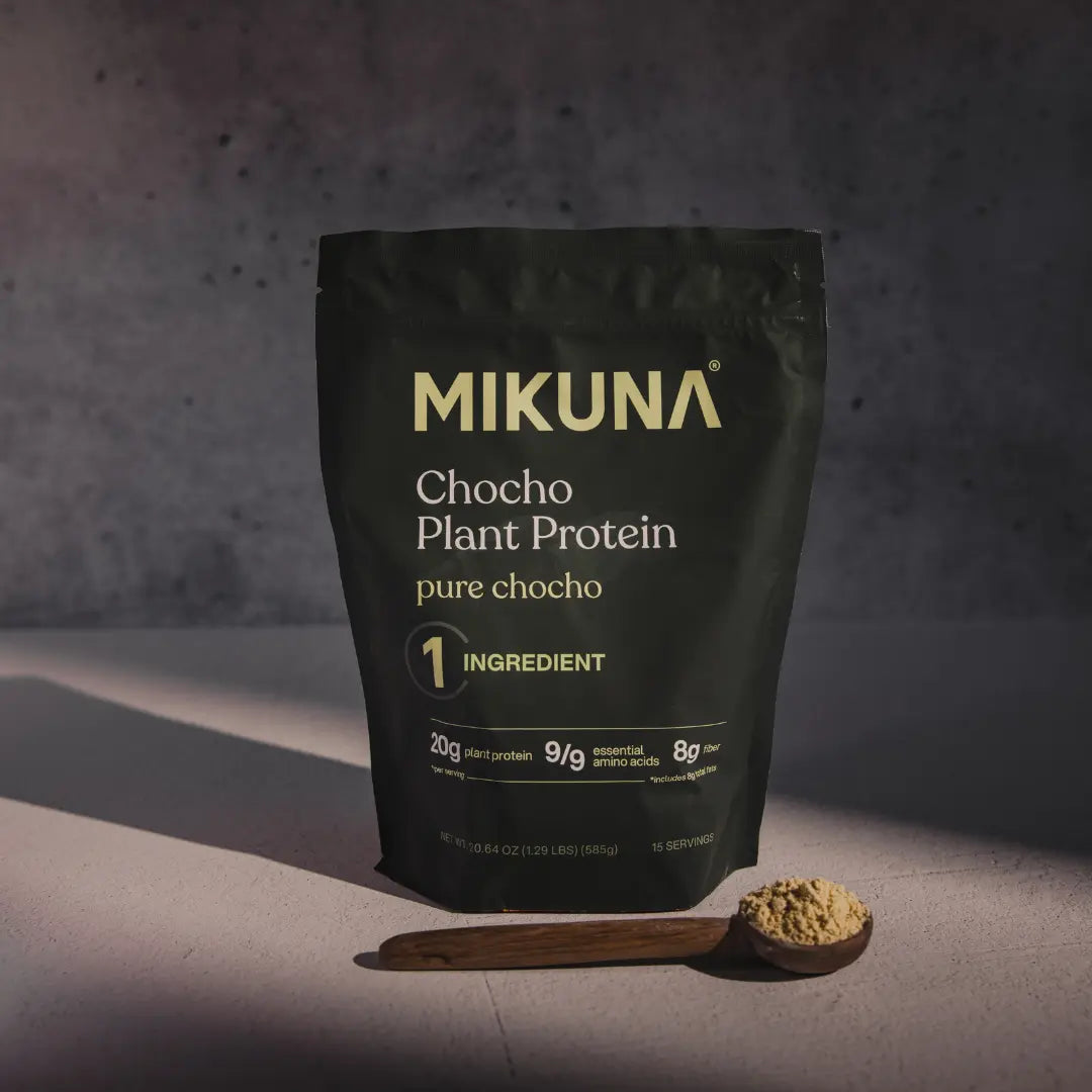 Chocho Plant Superfood Protein Powder package with wooden spoon, showcasing 20g protein and 9 essential amino acids.