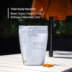NOVOS Vital gummies bag on table highlighting total-body benefits for brain, eyes, heart, liver, kidneys, muscles, and gut.