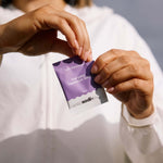 Person holding a packet of Sodii - Everyday Hydration Salts, designed for effective hydration with natural electrolytes.