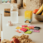 Everyday Hydration Salts Raspberry by Sodii displayed on a kitchen counter with water and fruits.