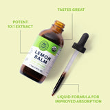 Lemon balm supplement bottle with dropper on a light green background