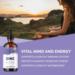 Supplement bottle labeled 'Zinc' with a scenic background of a woman sitting by a lake at sunset.