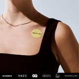 Image of a person wearing a WHAT'S THAT PATCH - NAD+ Longevity patch on their shoulder.